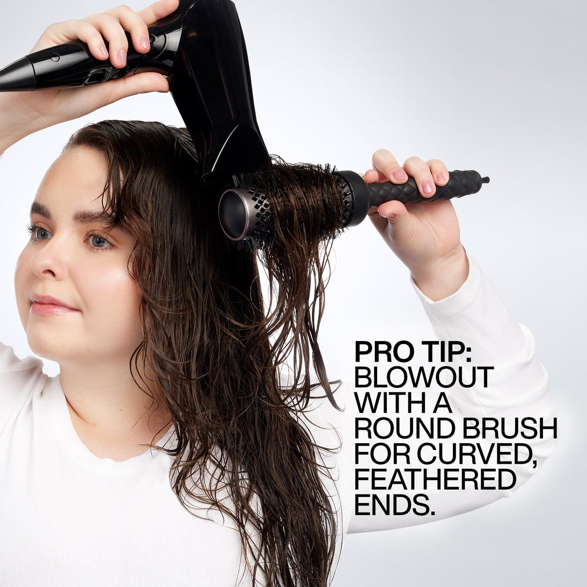 Redken Big Blowout applied to damp hair for even heat protection
