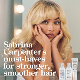 Redken bonding conditioner used on curly hair to reduce frizz and improve definition