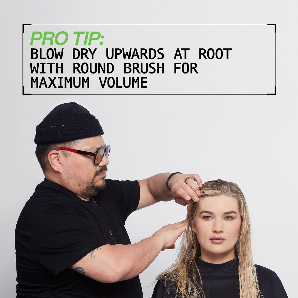 Redken bottle shown in hand for size and usage perspective