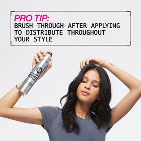 Redken Brushable Hairspray controlling curly hair detail to show defined, touchable curls