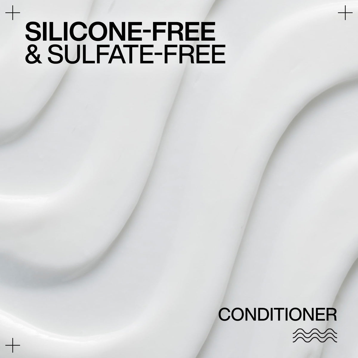 Redken conditioner being applied for even distribution and improved curl pattern