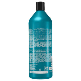 Redken product ingredients close-up highlighting biotin and castor oil benefits