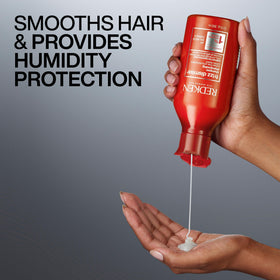 Redken shampoo in shower demonstrating gentle cleanse and frizz control