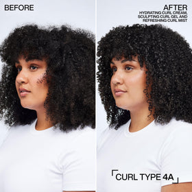 Redken cream texture on fingers showing lightweight consistency for easy distribution