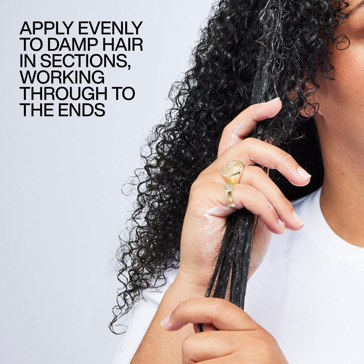 Redken used while diffusing curly hair showing heat protection and defined results