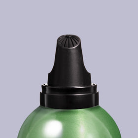 Redken label close-up highlighting heat and humidity protection