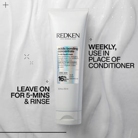 Redken mask bottle next to everyday items showing 8.5 fl oz scale