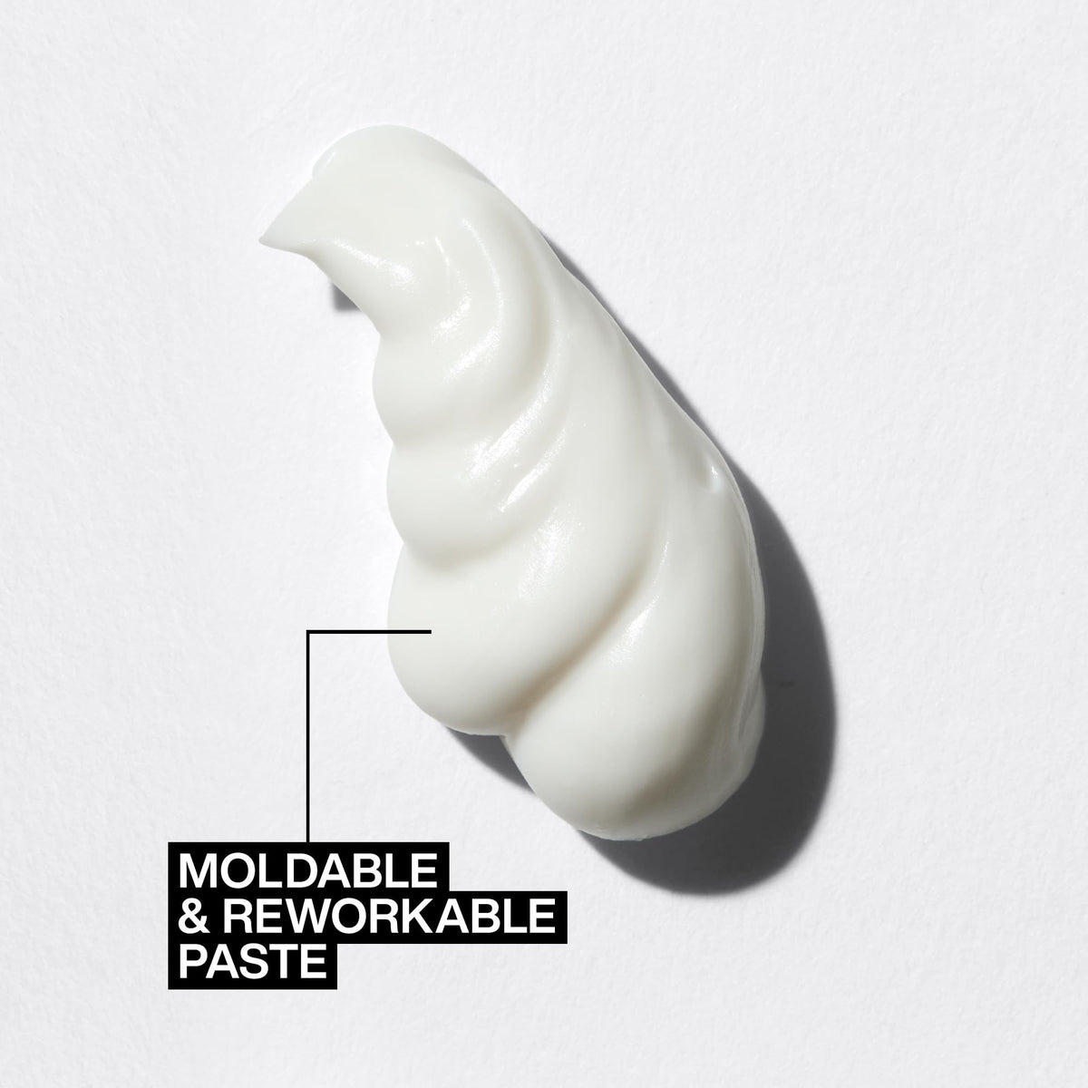 Redken hands applying paste demonstrating easy distribution and control