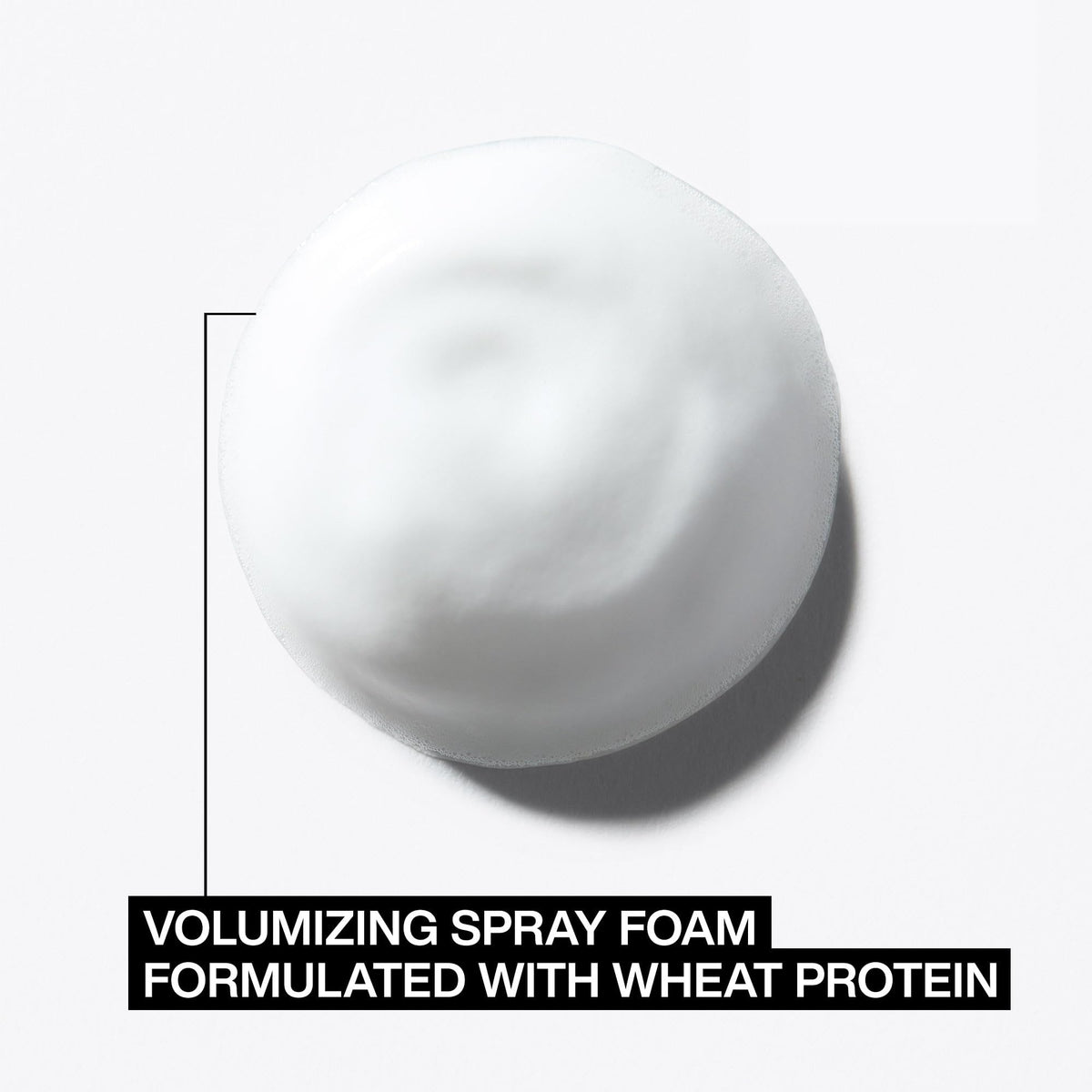 Redken foam being applied during blow dry to boost root lift