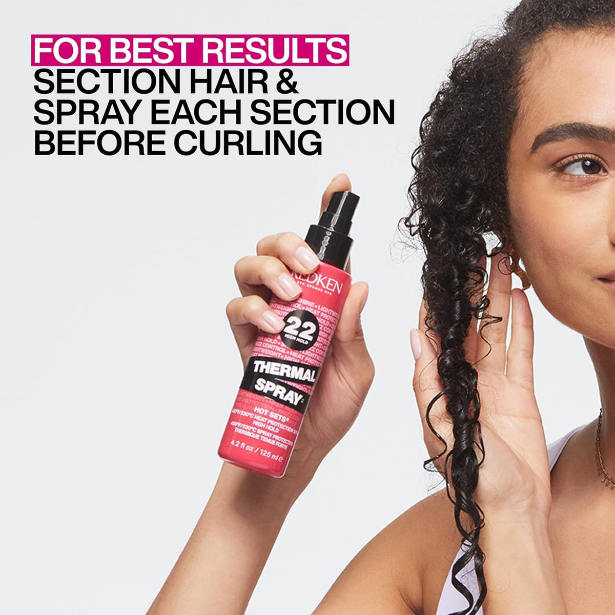 Redken being applied before curling iron to protect hair and hold style