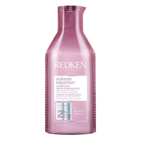 Redken bottle front view showing label and size, highlights lightweight volume