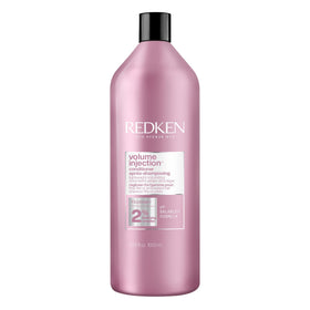 Redken front bottle showing product branding and quick benefit