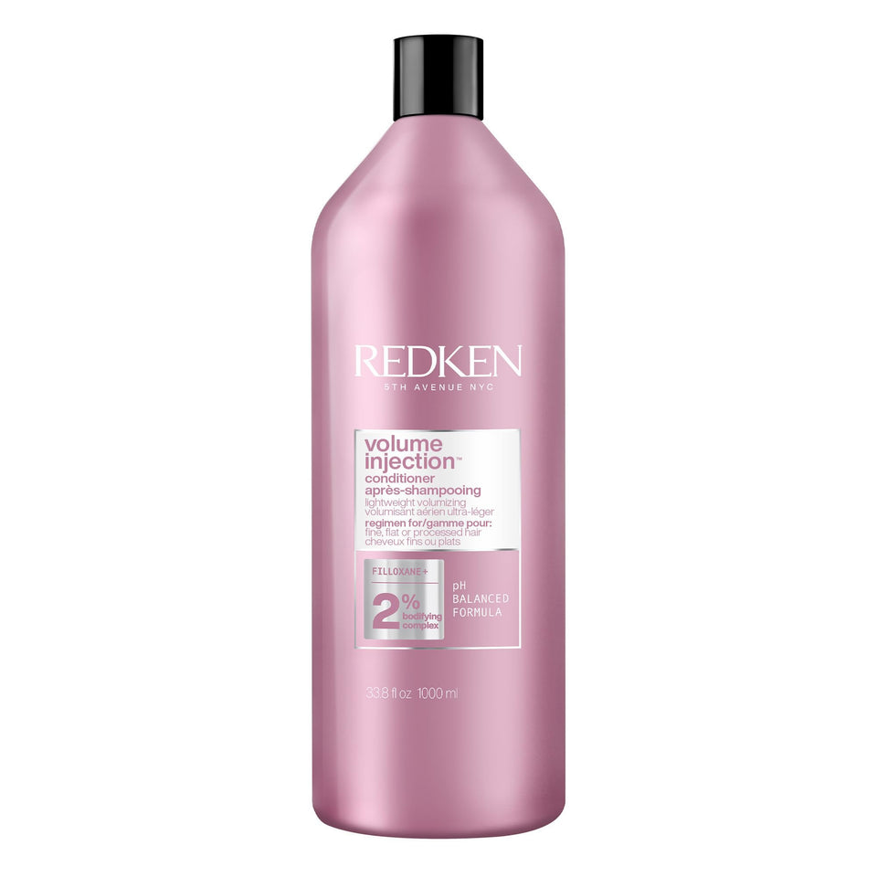 Redken front bottle showing product branding and quick benefit