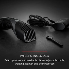 Remington trimmer held in hand showing scale and portability for travel convenience