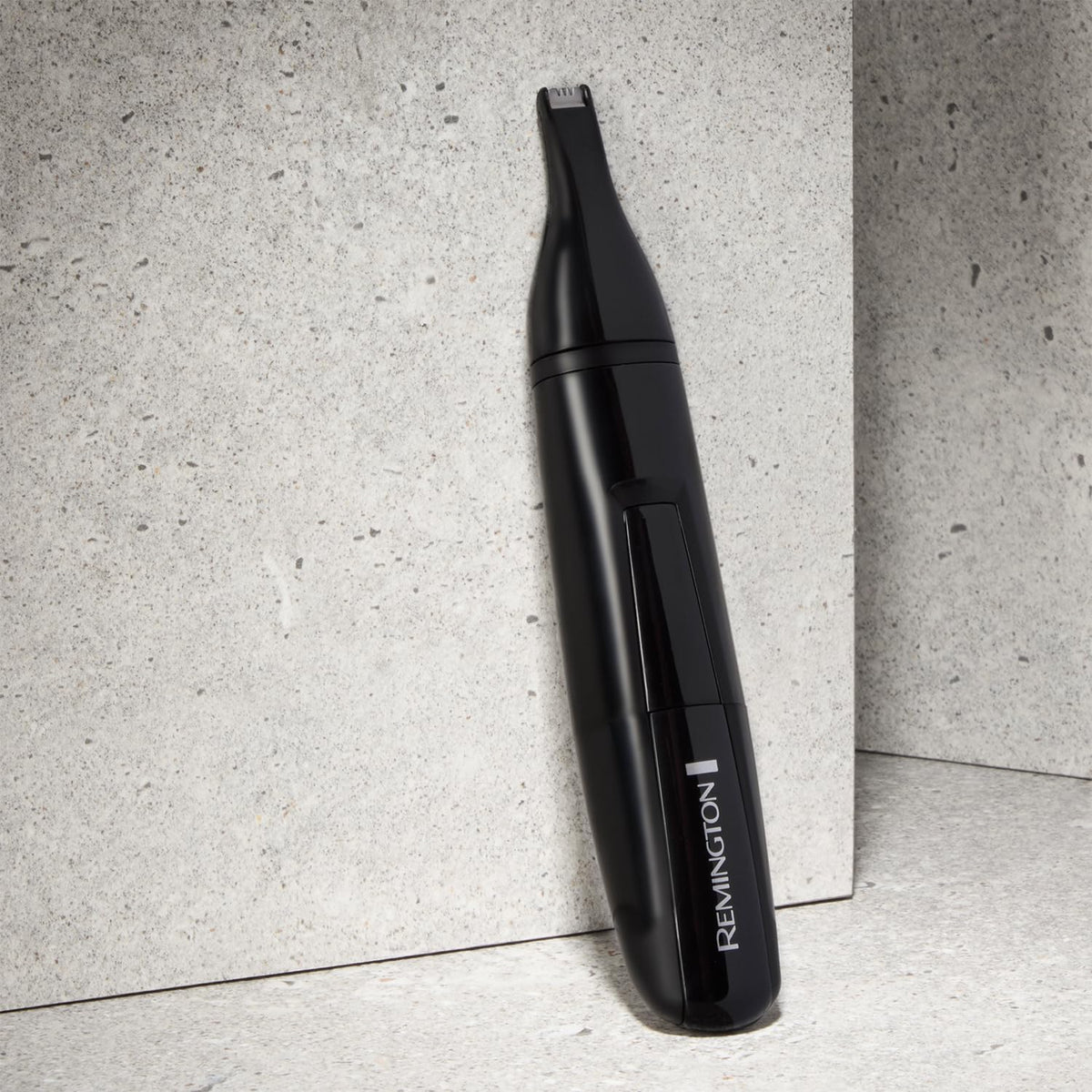 Remington NE3150 held in hand to show lightweight control and scale
