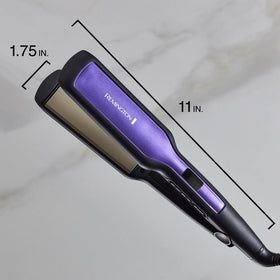 Remington size comparison next to hand showing 1.75-inch plates for broader coverage