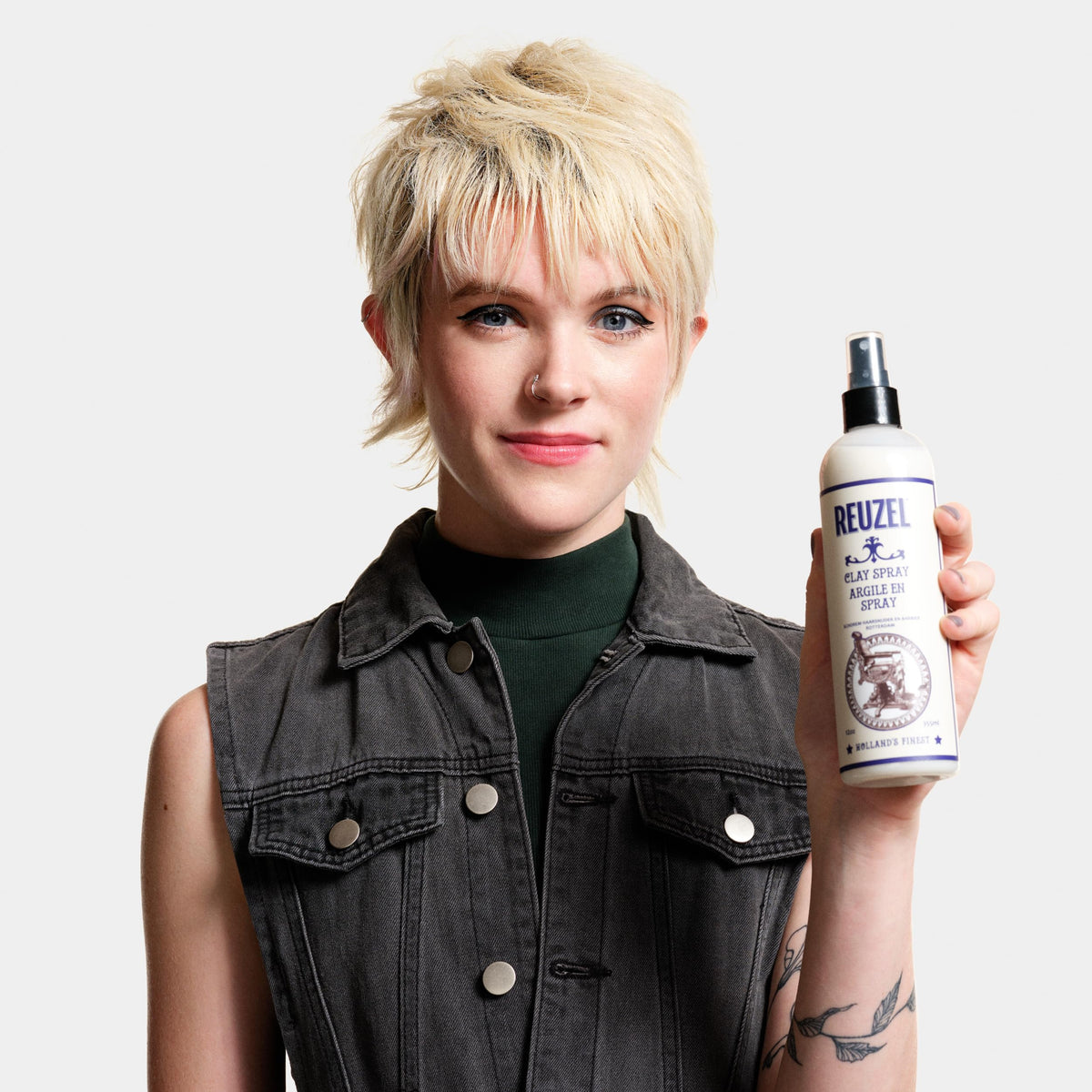 Reuzel ingredients label close-up showing vegan formula and clean benefits
