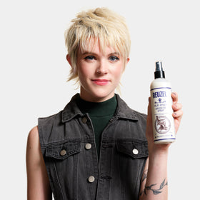 Reuzel ingredients label close-up showing vegan formula and clean benefits