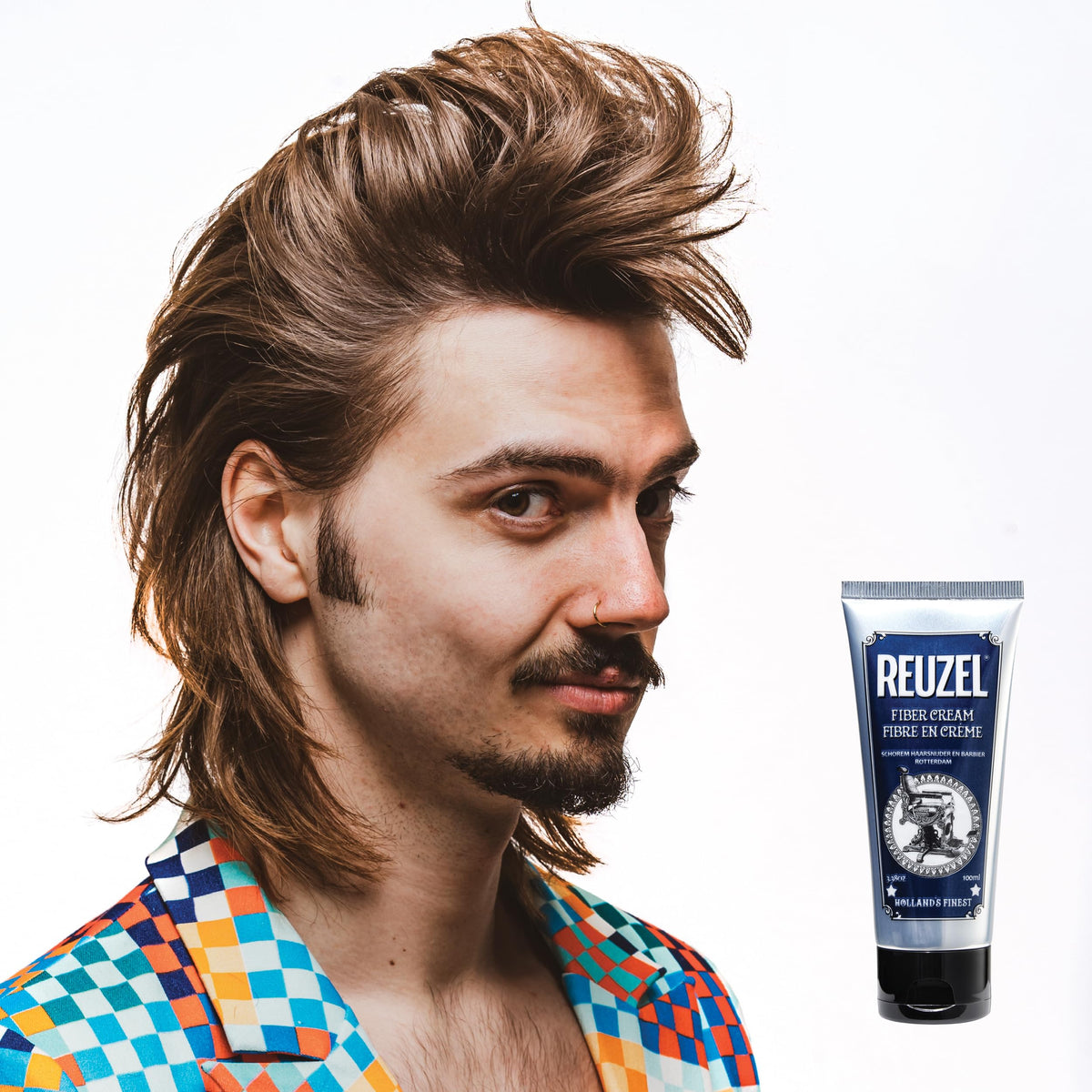 REUZEL pot next to coin showing compact travel-ready size benefit