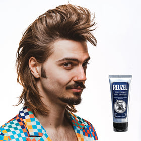 REUZEL pot next to coin showing compact travel-ready size benefit