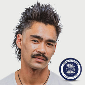REUZEL fiber pomade on bathroom shelf in lifestyle setting for daily grooming convenience
