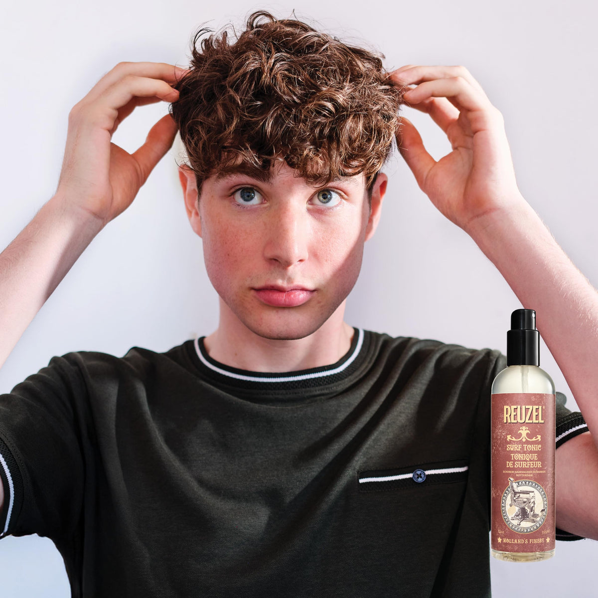 REUZEL in bathroom being used during styling routine for simple daily grooming