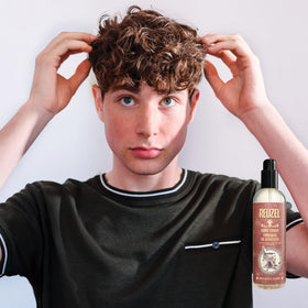 REUZEL in bathroom being used during styling routine for simple daily grooming