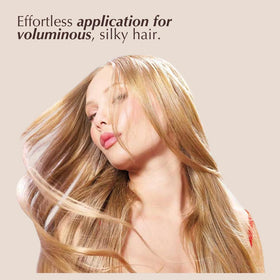 Rev320 being applied to wet hair demonstrating detangling benefit