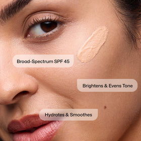 Revision Skincare tinted swatch blended on skin showing universal tint effect