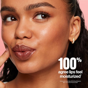 REVLON close-up of balm applied on lips showing smooth finish and visible plumping effect