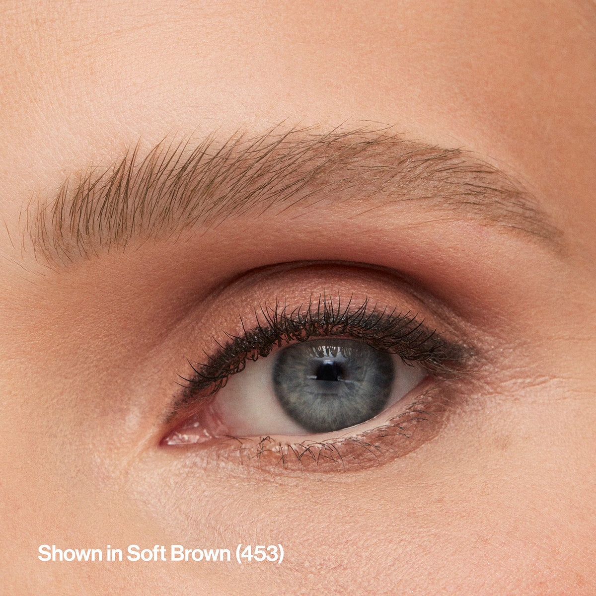 REVLON brow pencil in use applying short strokes to eyebrow for realistic fill and lasting definition benefit