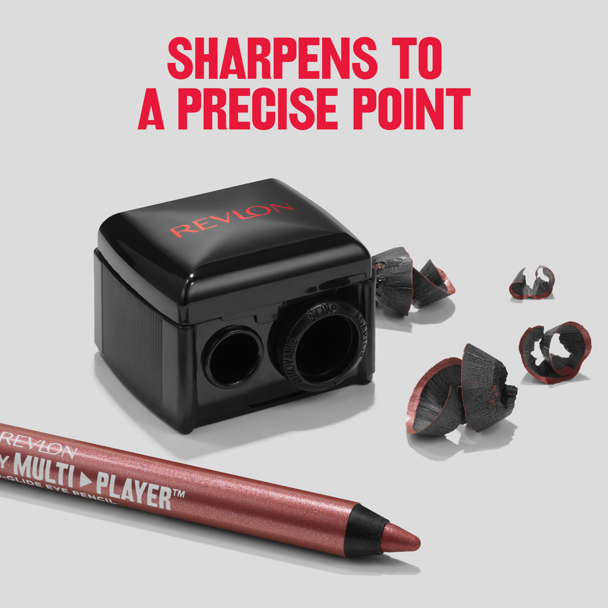 REVLON pencil tucked into a compact travel kit for on-the-go convenience