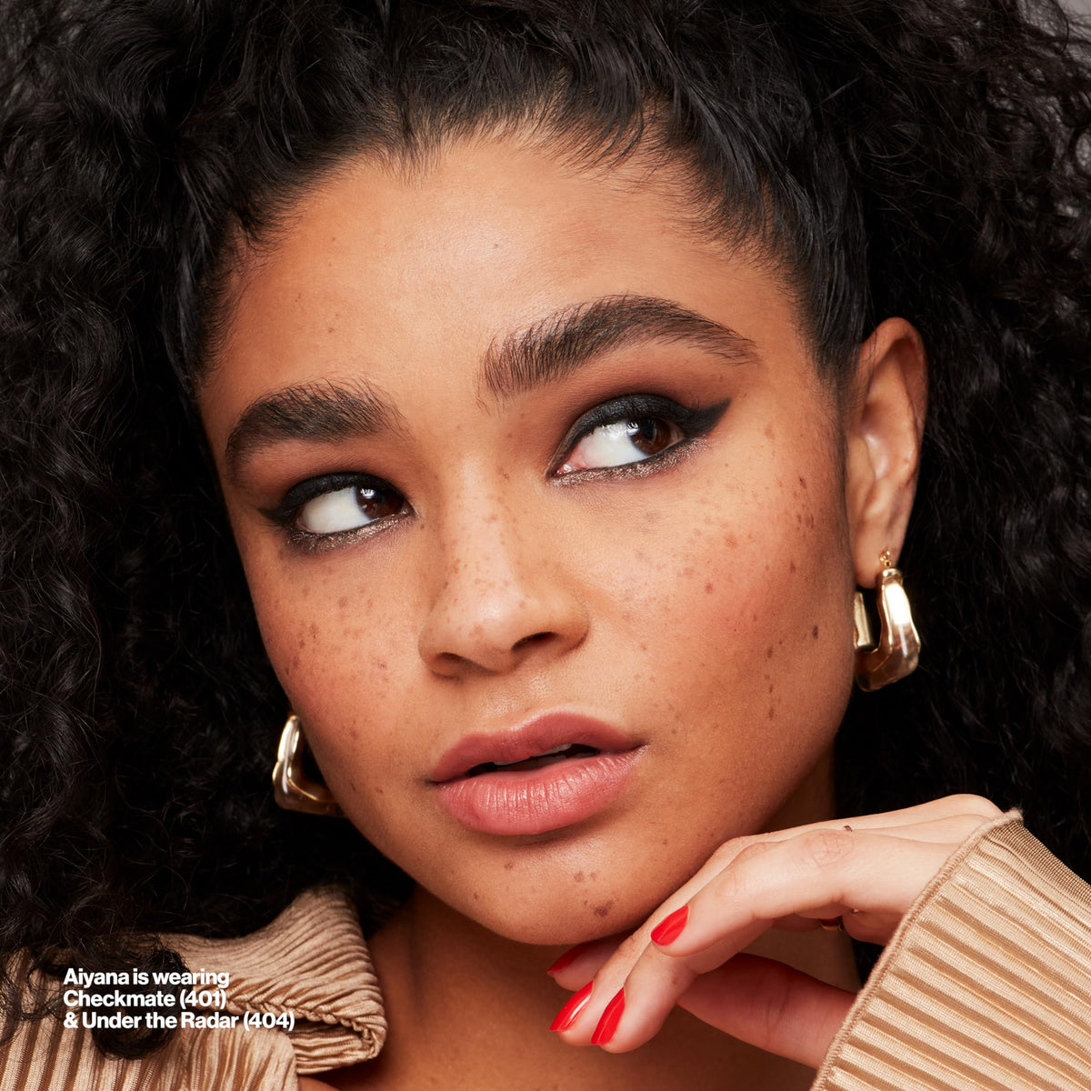 REVLON pencil in use along upper lash line for defined eyes benefit