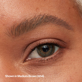 Revlon ColorStay Micro pencil held in hand to show compact size and easy control