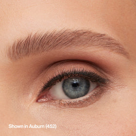 Revlon pencil styled in a makeup pouch for travel-ready eyebrow grooming