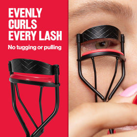 Revlon extra curl in hand scale demonstrating compact travel-friendly size