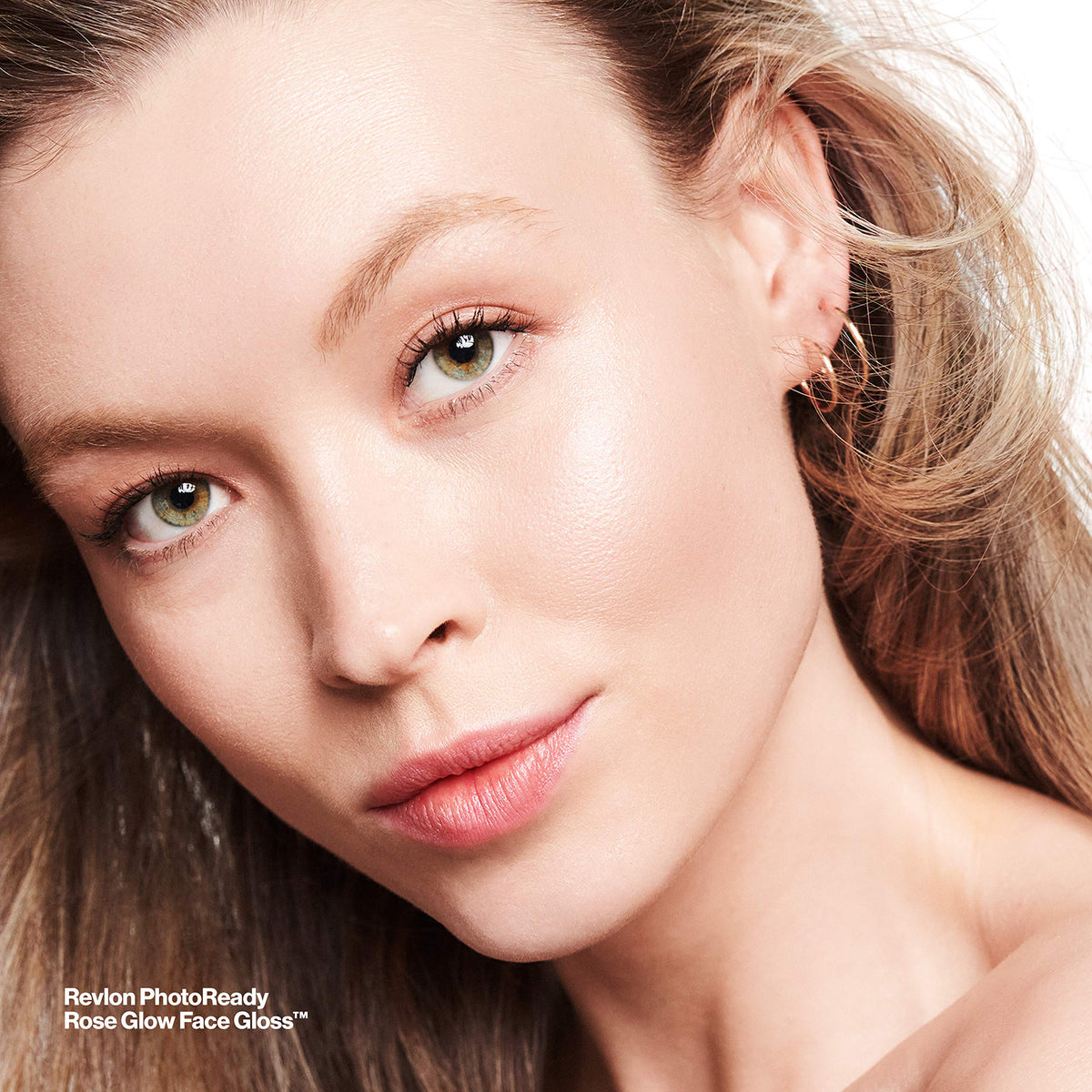 Revlon face gloss on bathroom counter staged for morning routine and effortless glow