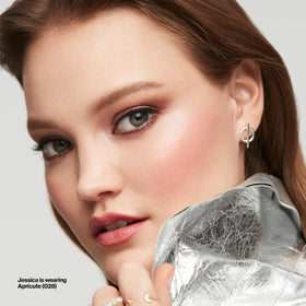 Model wearing Revlon Oh Baby! Pink on cheeks for healthy radiance