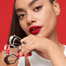 Revlon held in hand for scale showing portable size and easy travel benefit
