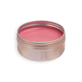 Revolution Beauty cheek application with fingers demonstrating natural flush and quick blending benefit