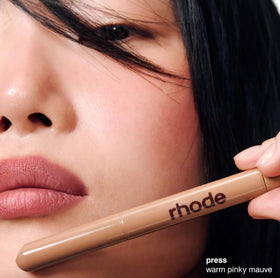 Rhode lip shaper tip close-up showing creamy texture and precise application benefit