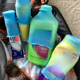 Rinseroo sleeves next to travel bottles showing fit and scale advantage