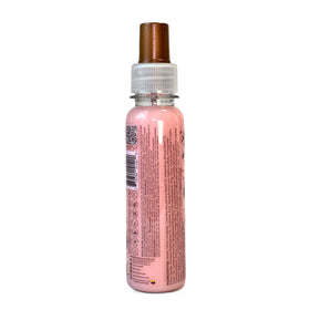 Ritual Botanico applied on hair at beach protecting from sun and salt