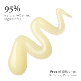 Rizos Curls scrunching gel into wet curls, enhances definition and reduces frizz