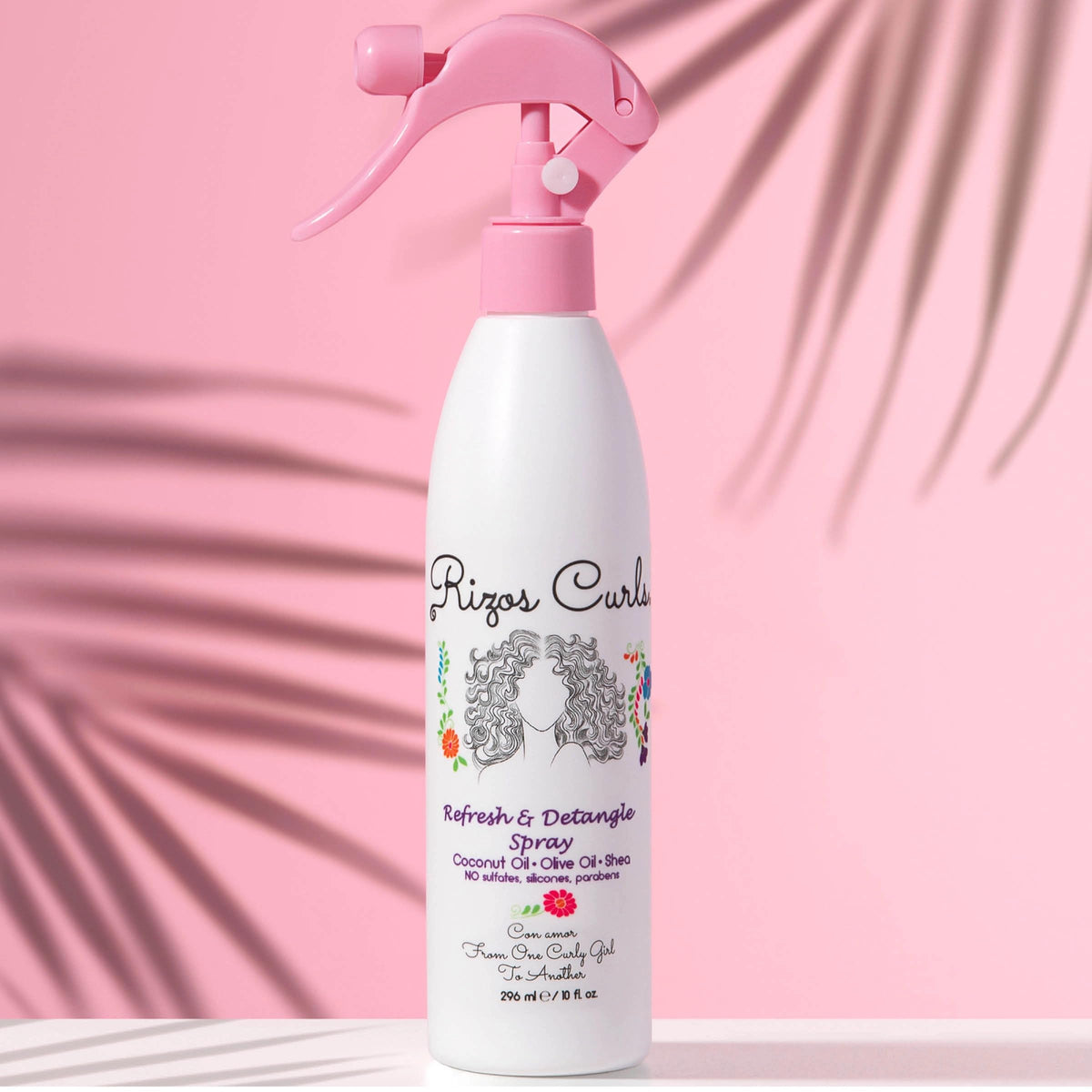 Rizos Curls ingredients close-up with coconut, olive oil, and shea butter benefits