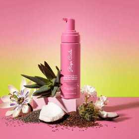 Rizos Curls mousse foam texture shown dense and lightweight for even coverage
