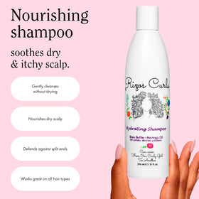 Rizos Curls shampoo in hand creating lather to remove buildup gently