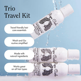Rizos Curls travel kit next to passport and toiletry bag for packing convenience