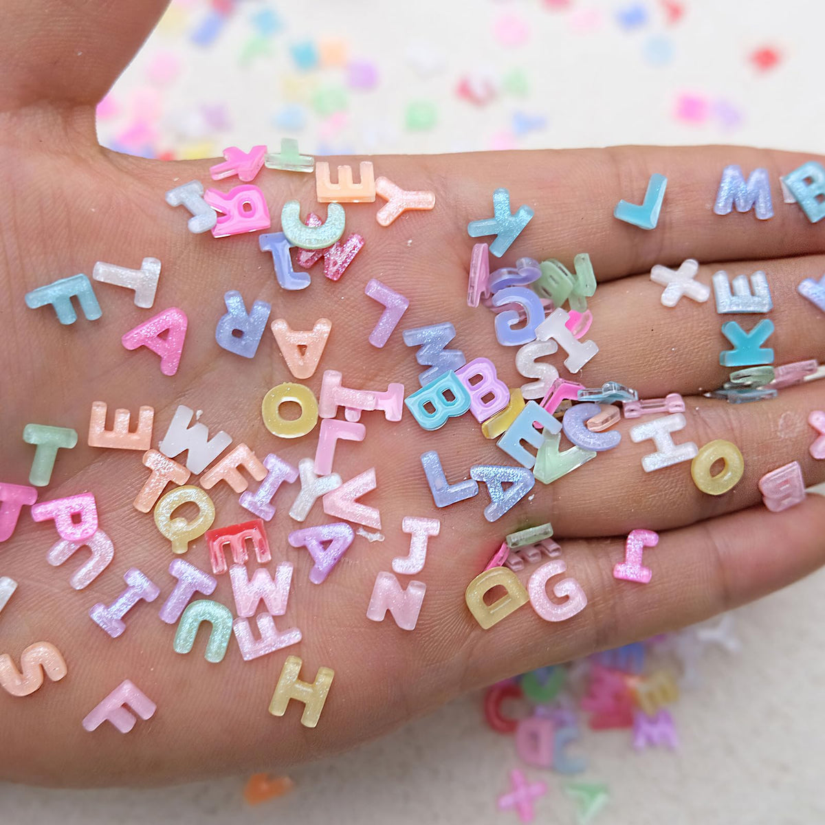 ROFIBUT glitter texture on letters highlighting sparkle and dimension
