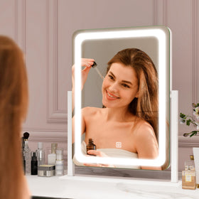 ROLOVE mirror in use applying makeup showing accurate lighting results